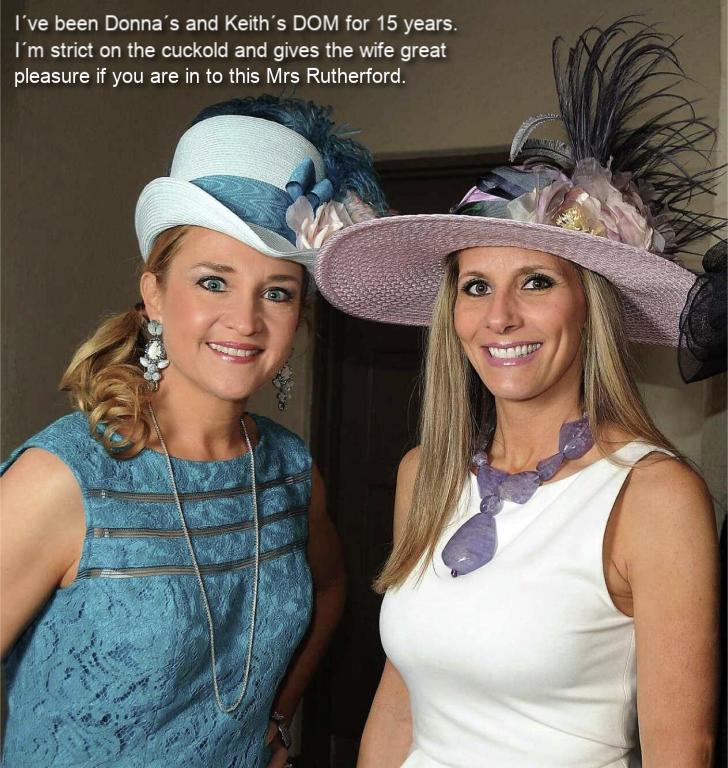 Two women posing together, both wearing stylish hats. The woman on the left has long hair and a blue outfit, while the woman on the right wears a white dress and has long hair. The background is a neutral color.